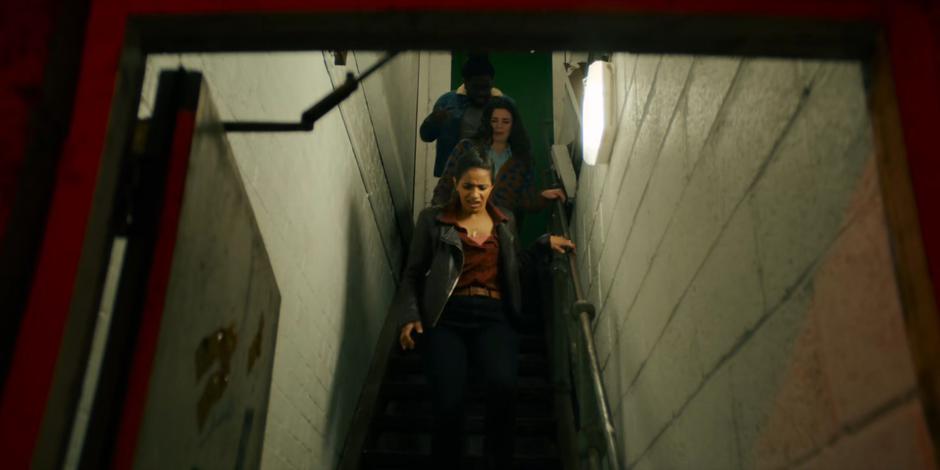 Yaz leads Sarah and Nick down to the basement to meet with Dan and the Doctor.
