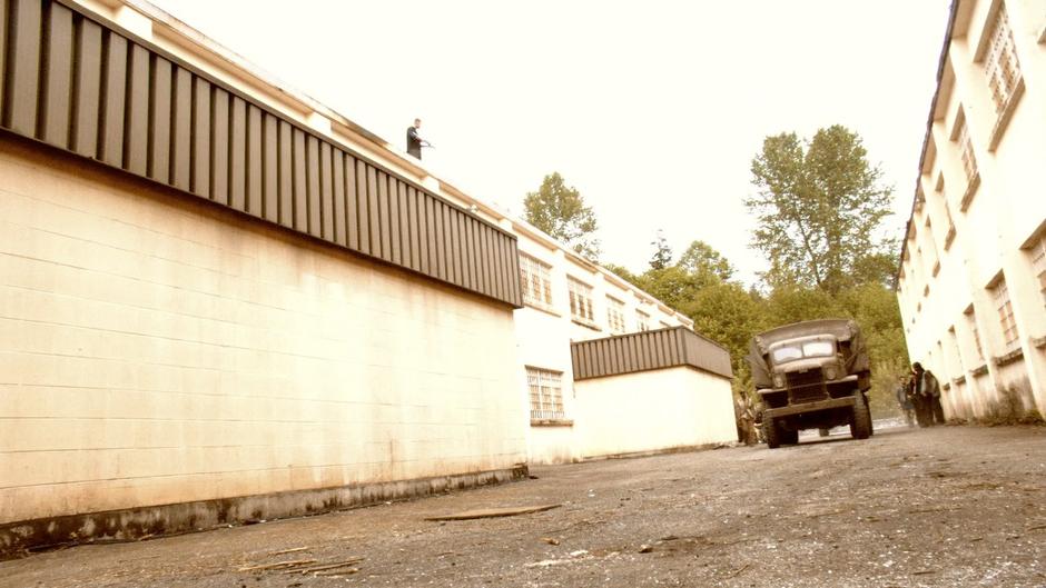 Truck containing Starbuck, Helo, and the other resistance fighters arrives back at the base.