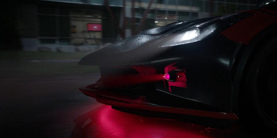 A missile emerges from the front of the Batmobile's bumper.