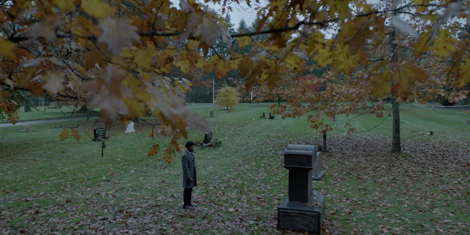 Luke talks to his father's gravestone.