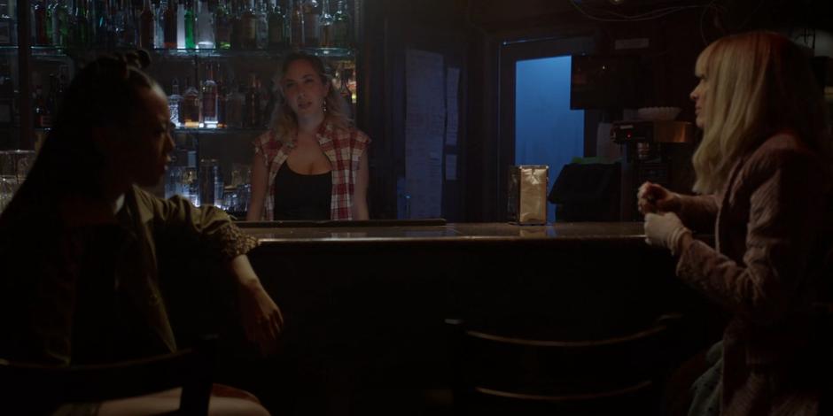 Mary and Alice share a look as the bartender approaches to ask them to leave.