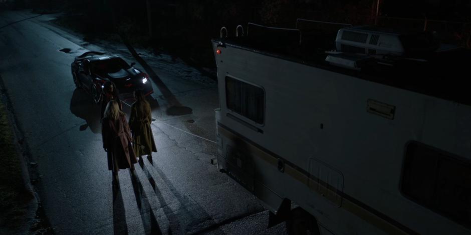 Ryan confronts Alice and Mary after stopping the RV with the Batmobile's grappling hook.