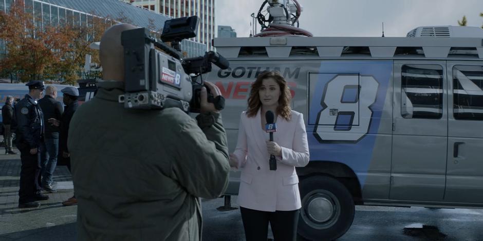 Dana Dewitt reports on Marquis's upcoming press conference from in front of her news van outside the building.