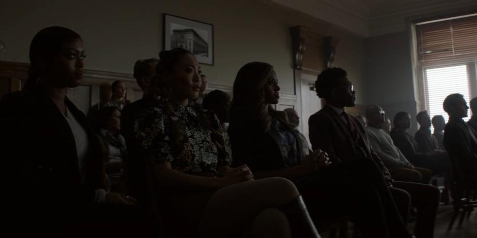 Ryan, Mary, Sophie, and Luke watch during Alice's hearing.