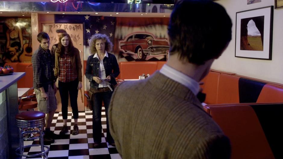 Amy, Rory, and River are surprised to see the Doctor alive.
