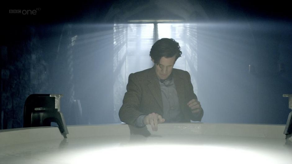 The Doctor is drawn to the pool of flesh.
