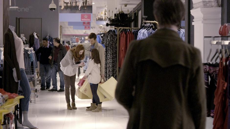 The Doctor spots Amy & Rory shopping.
