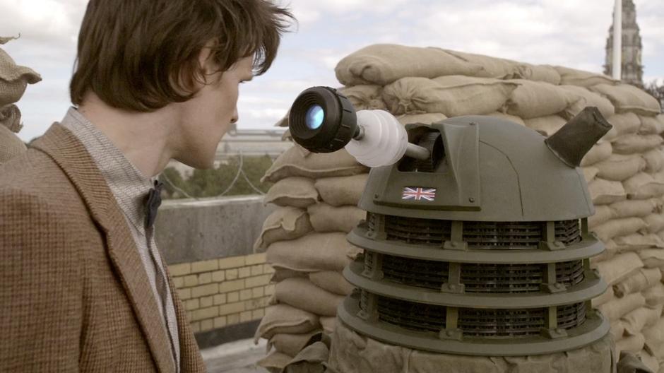 The Doctor stares down a Dalek.