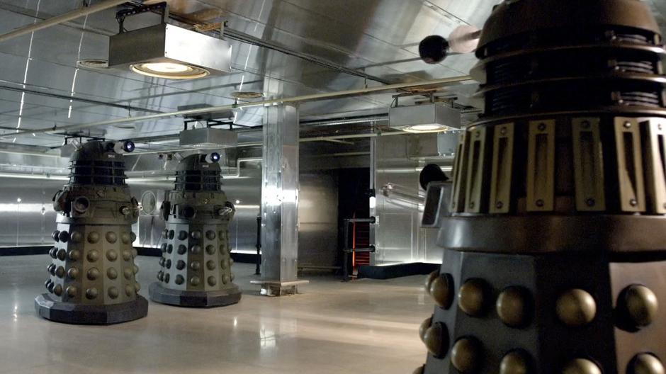The Daleks talk about things in their spaceship.