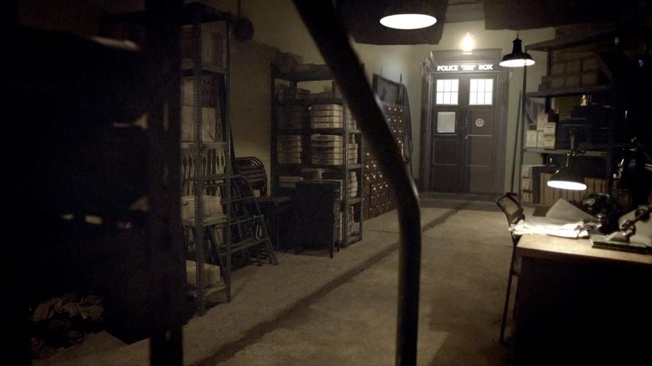 The TARDIS reappears in the War Rooms storage room.