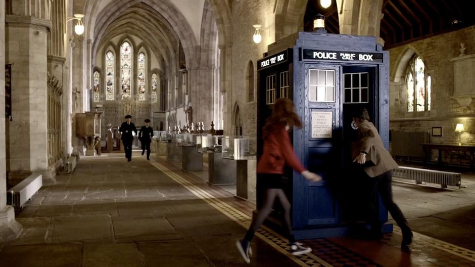 The Doctor and Amy flee from museum guards after stealing the box.