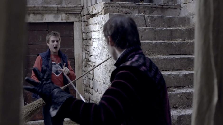 Rory fights off Francesco with a broom.