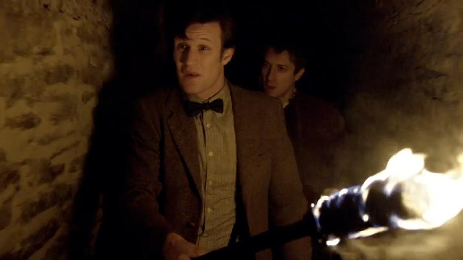 Rory and the Doctor make their way through the tunnels beneath the mansion.