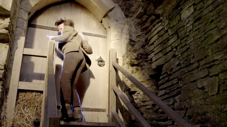 The Doctor is shocked by the door into the mansion.