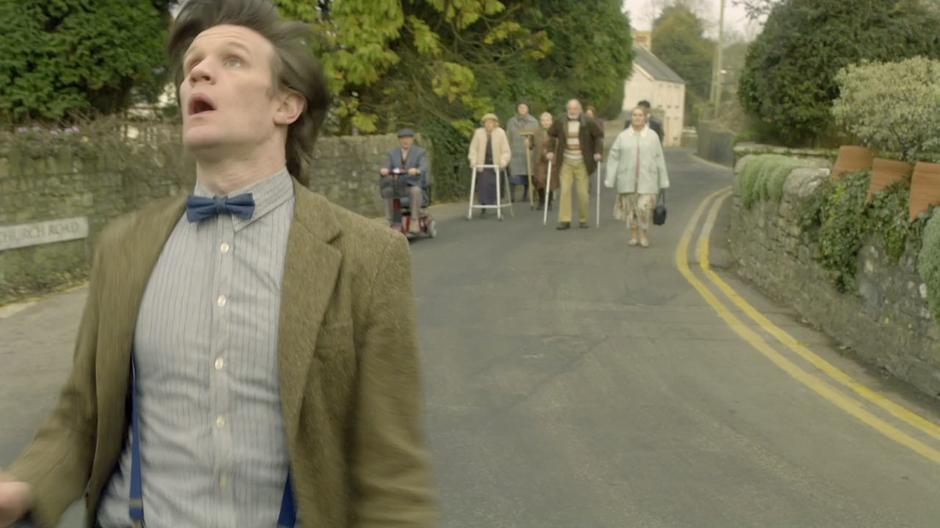 The Doctor runs from a mob of old people.