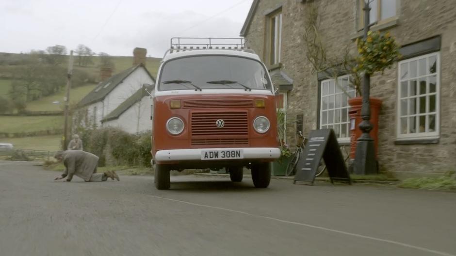 The Doctor drives away in his newly acquired van.