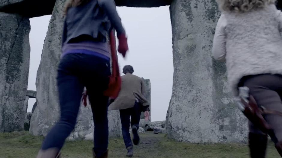 Amy, Rory, and the Doctor approach Stonehenge.