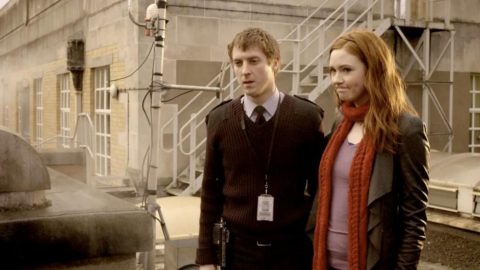 Amy and Rory after River arrives safely on the roof.