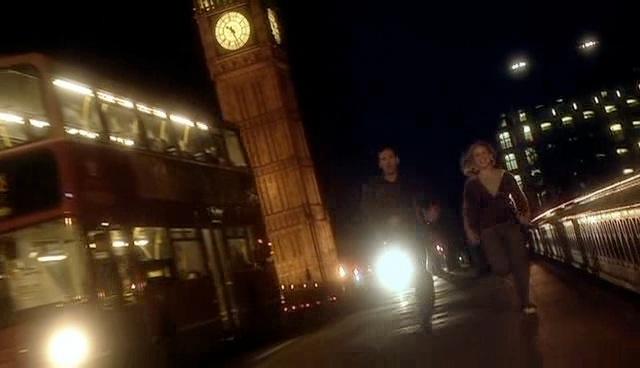 Rose and the Doctor run across the bridge towards the London Eye.