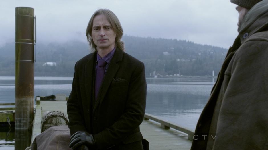 Mr. Gold listens to Leroy describe his boat.