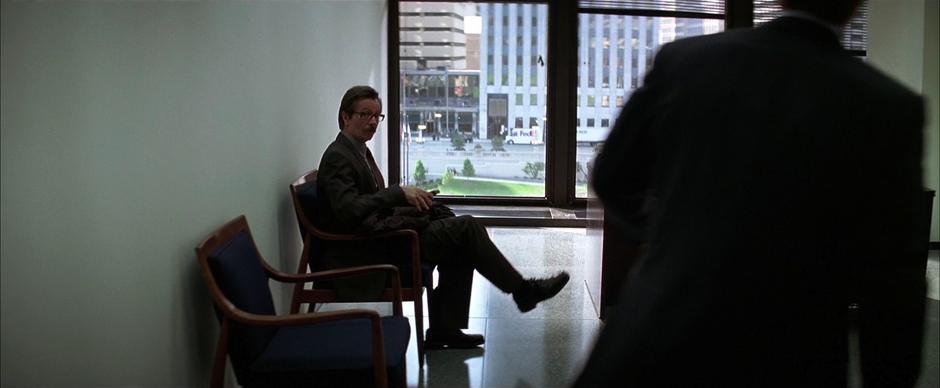 Jim Gordon is waiting when Harvey Dent returns to his office.