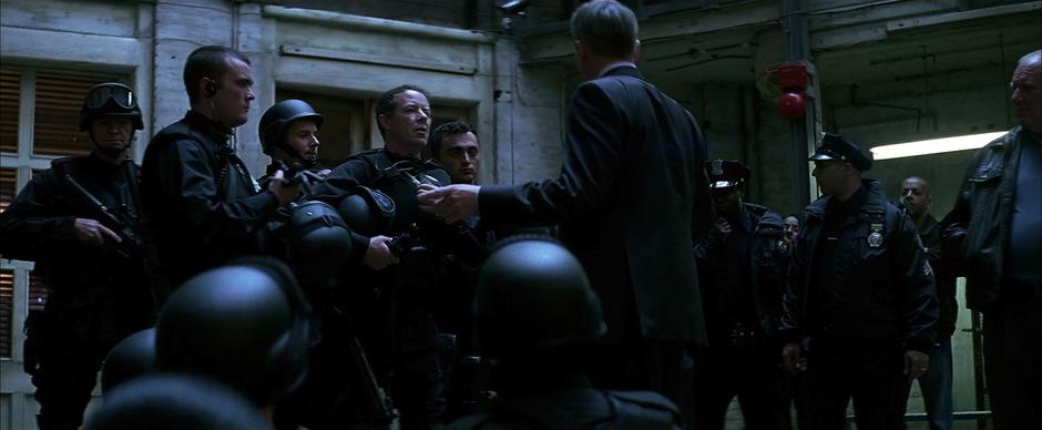 The SWAT teams gets ready to transport Harvey Dent across the city.
