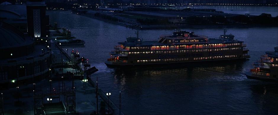 Two ferries pull away from the dock.