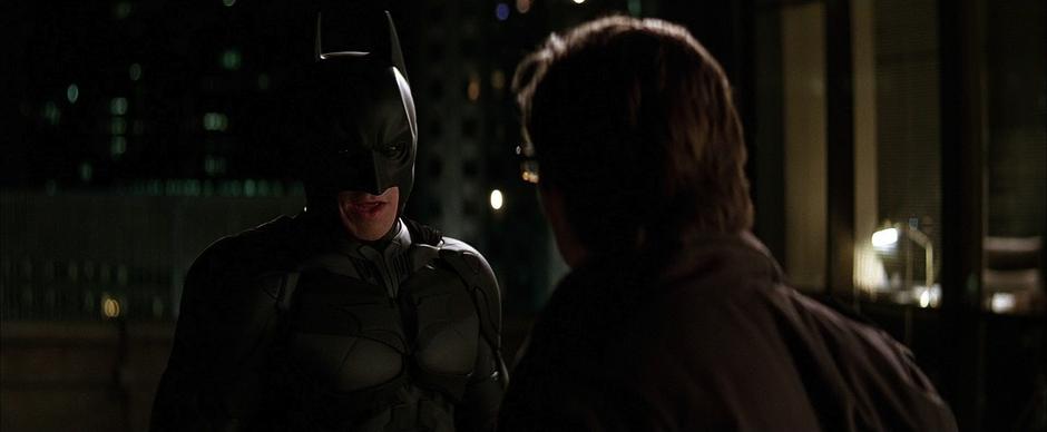 Batman talks Jim Gordon into holding off the SWAT team for a couple of minutes.