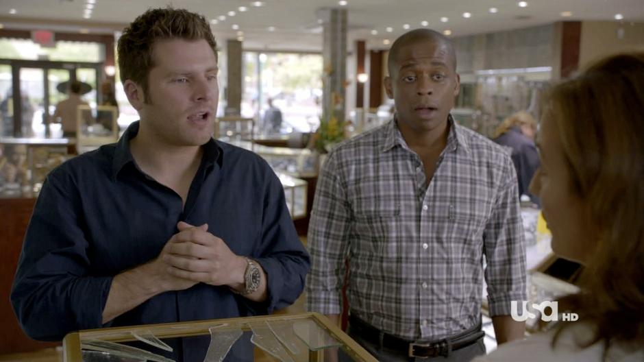 Shawn and Gus talk to the manager of the jewelry store.