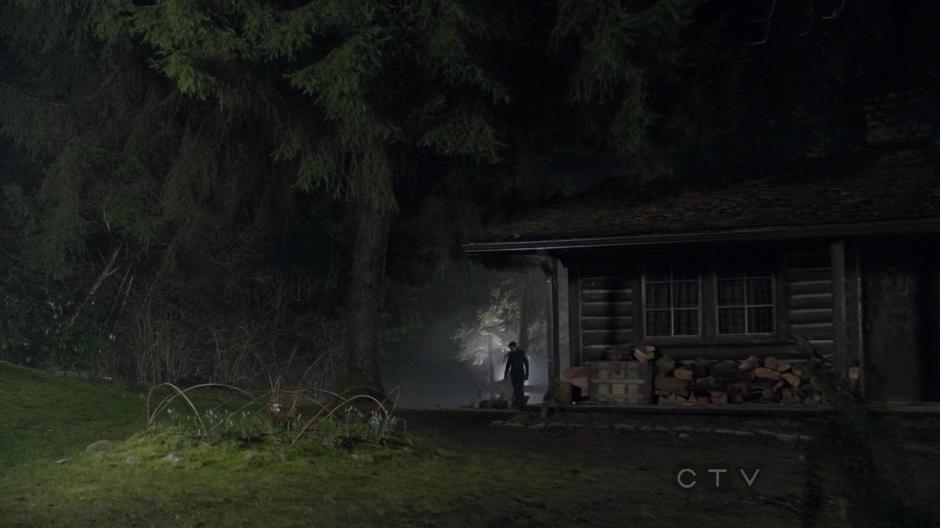August Booth searches for the dagger in the ground around Mr. Gold's cabin.