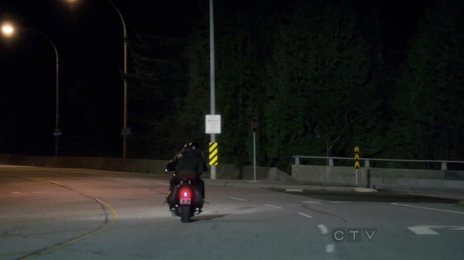 Emma and August drive onto a bridge.