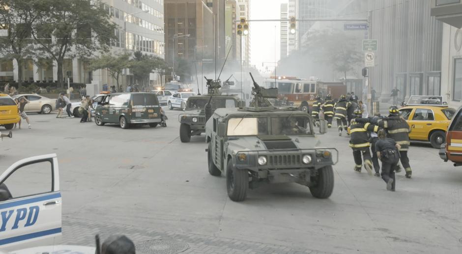 Firefighters help evacuate civilians while soldiers shoot at the Chitauri. Shot at Euclid Avenue and East 9th Street looking north.