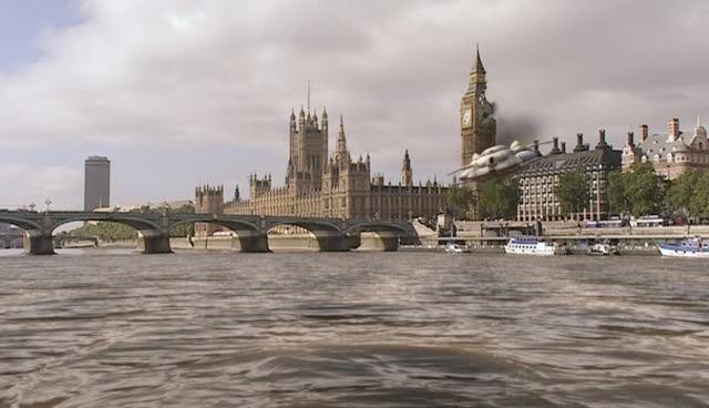 The Slitheen spacecraft plunges into the Thames in front of the bridge after crashing through Big Ben.