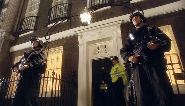 Armed guards stand outside Downing Street.