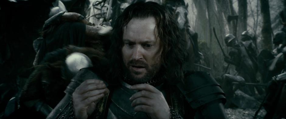 Isildur puts on The One Ring while under attack by orcs.