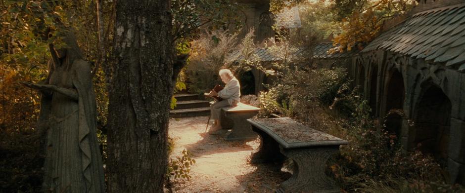 After waking up, Frodo spies Bilbo reading in Rivendell.