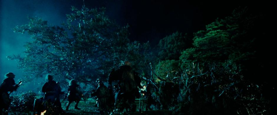 Saruman's orcs tear down one of the ancient trees at Isengard.