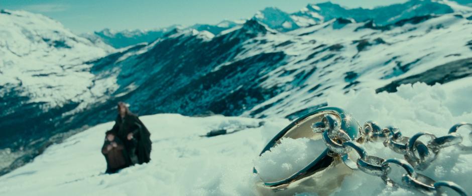 The Ring sits on the ground where Frodo dropped it while rolling down the slope.