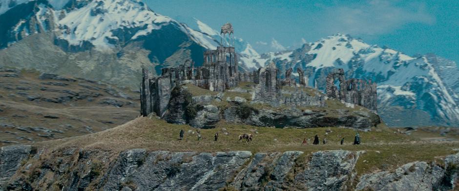 The Fellowship treks around some hilltop ruins on their way from Rivendell.