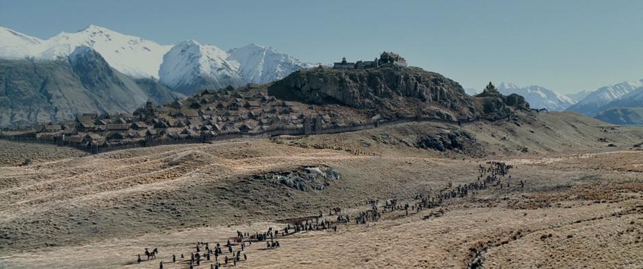 Refugees stream out of Edoras on their way to Helm's Deep.