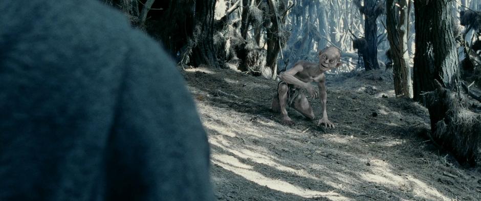 Gollum beckons Frodo and Sam onward towards Mordor.
