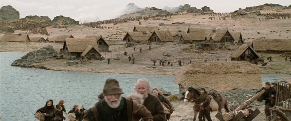 Rohan villagers run from the Hillmen hordes.