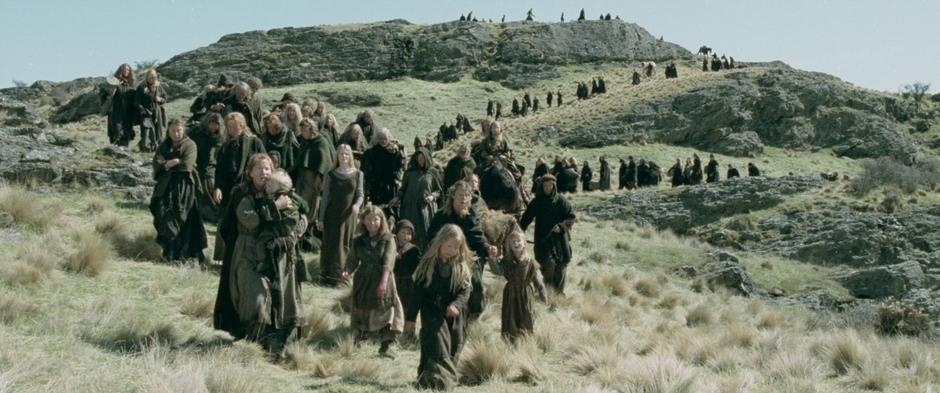 Refugees come down the hillside and see Helm's Deep for the first time.