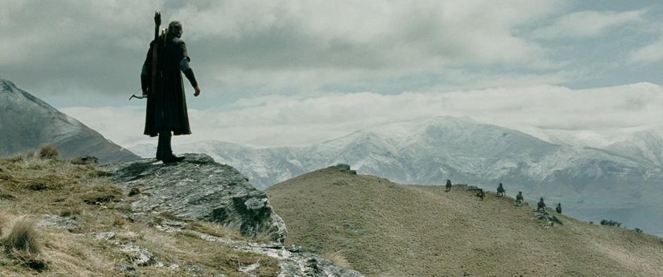 Legolas spies wargs running over a hill towards the group.