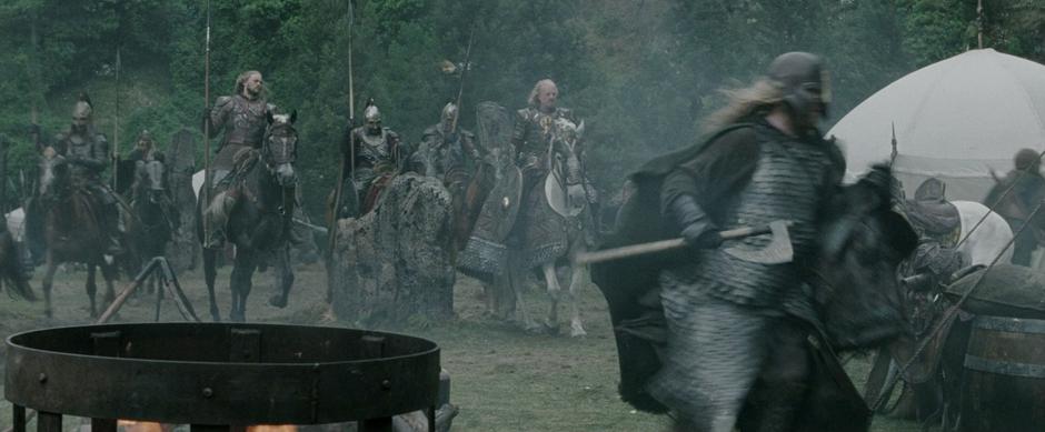 Theoden rides though the Dunharrow upper camp while his soldiers get ready for battle.