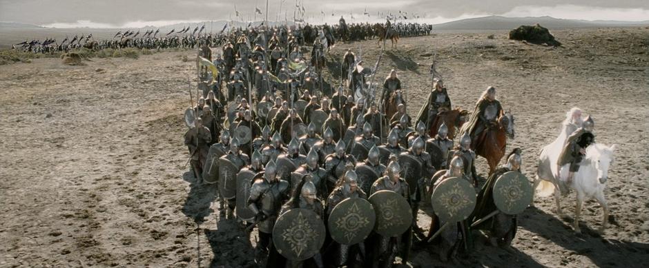 The armies from Gondor and Rohan march to the Black Gate.