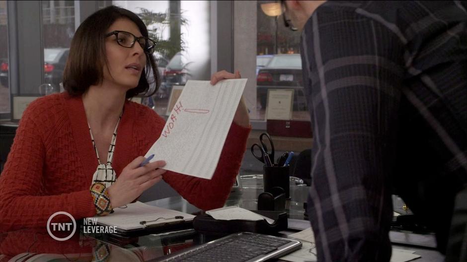 Sophie shows off the fake message she found in the signal to James Kanack in his office.