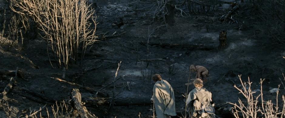 Gollum leads Frodo and Sam on the path towards Minas Morgul.