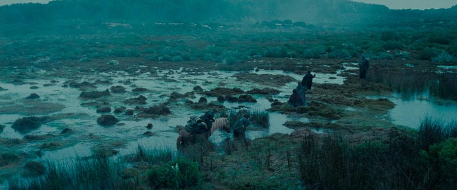 The Hobbits are led by Aragorn through a swamp on the way to Rivendell.
