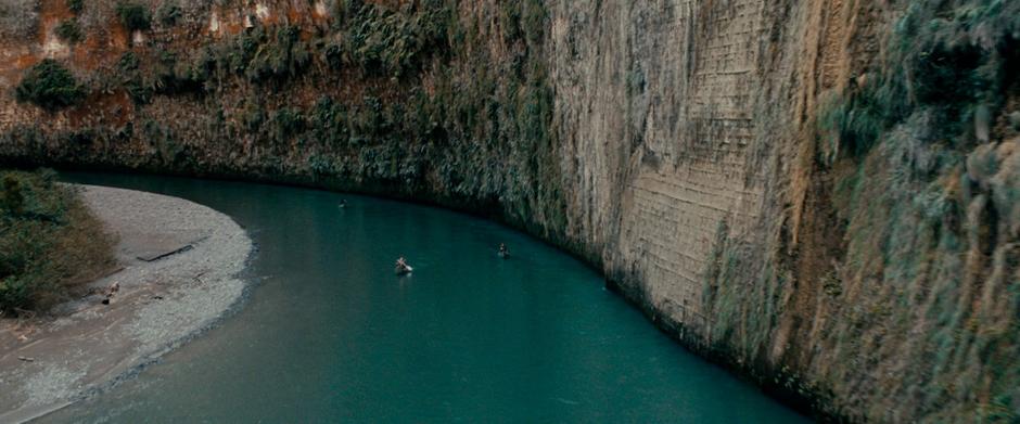 The Fellowship rounds a bend in the Anduin River on their way south.